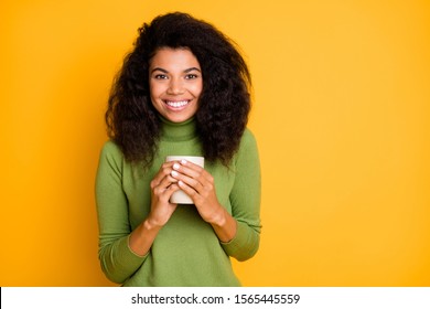 Photo Of Cheerful Positive Curly Pretty Sweet Girlfriend Holding Mug Of Coffee Smiling Toothily Isolated Over Vivid Color Background