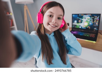 Photo of cheerful positive cute lovely girl blogger gamer showing room recording video live stream indoors house - Powered by Shutterstock