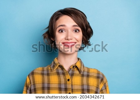 Photo of cheerful positive girl toothy beaming smile wear checkered shirt isolated blue color background