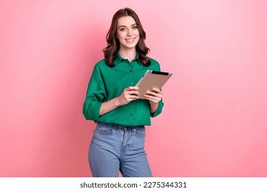 Photo of cheerful pretty corporate girl hold use tablet toothy smile isolated on pink color background