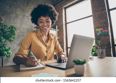 Photo of cheerful pretty cute nice girlfriend having been employed to job as executive smiling toothily sitting at desktop with laptop noting down important information