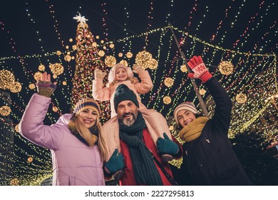 Photo of cheerful school children husband wife cuddling walking x-mas park waving arms riding shoulders urban city market - Powered by Shutterstock