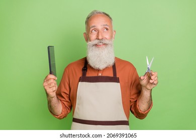 Photo Of Cheerful Senior Man Haircut Hair Care Wondered Interested Look Empty Space Isolated Over Green Color Background