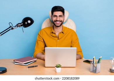 Photo Of Cheerful Successful Man Desktop Workstation Use Netbook Isolated On Blue Color Background