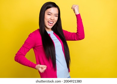 Photo of cheerful young happy nice woman winner fists celebrate luck isolated on shine yellow color background