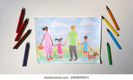 Photo of child's drawing with colored pencils. Picture shows family. Mom, dad, boy, girl, dog are walking together. Mom of African American appearance. Dad is white. Pencils around. White background. - Powered by Shutterstock