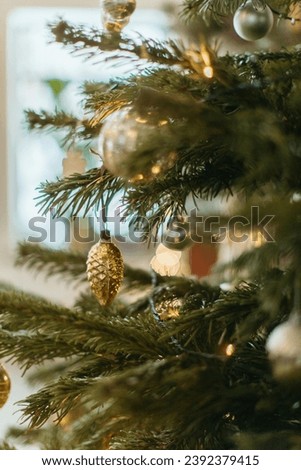 photo of Christmas tree accessories, photo focusing on the oval-shaped gold accessories, can be used as an addition to your Christmas design 