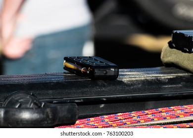 Photo Of A Clip Of Ammo For A Gun Sitting On A Truck Bed