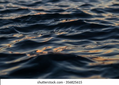 Photo Closeup Of Beautiful Clear Dark Blue Sea Ocean Water Surface With Ripples Low Waves On Seascape Background, Horizontal Picture 