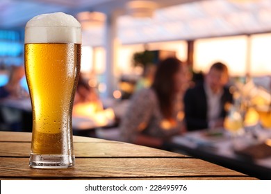 Photo Of Cold Beer Glass On The Bar Table.