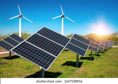 Photo collage of solar panels, photovoltaics, with sun tracking systems and wind turbines -  alternative electricity source, concept of renewable energy sources and sustainable resurses