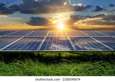 Photo collage of sunset and solar panel, photovoltaic, alternative electricity source - concept of sustainable resources - Shutterstock ID 2100590674