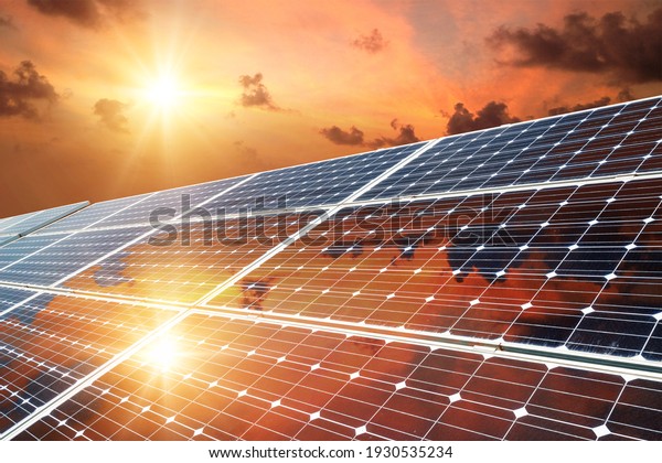 Photo collage of sunset and solar panel,\
photovoltaic, alternative electricity source - concept of\
sustainable resources