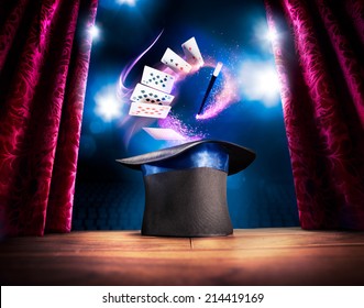 Photo Composite Of A Magic Hat On A Stage With Cards And A Magic Wand