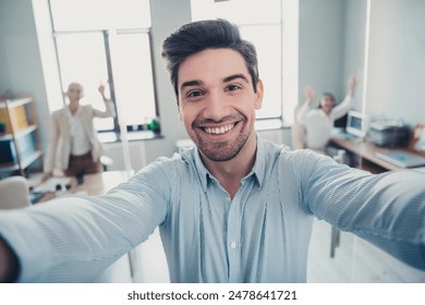 Photo of confident business man recording video make selfie in workstation - Powered by Shutterstock