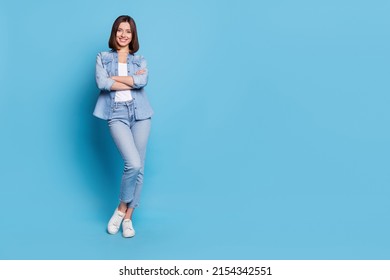 Photo of confident charming woman wear jeans shirt arms crossed smiling isolated blue color background