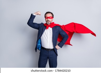 Photo of confident courage professional mature business  man with super hero costume show biceps wear blue suit red face mask cloak isolated grey background - Powered by Shutterstock