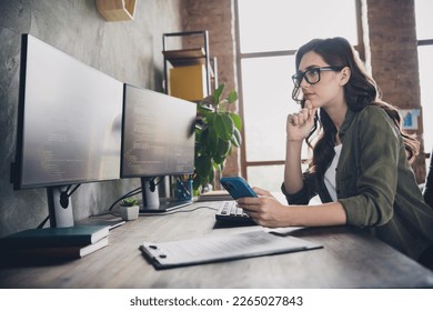 Photo of confident intelligent lady programmer wear eyeglasses ordering food eshop modern device indoors workplace workstation
