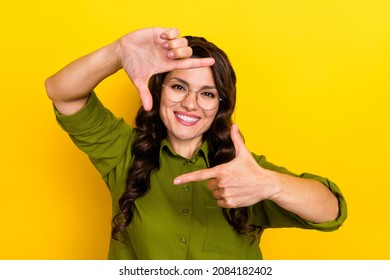 Photo Of Confident Lady Make Frame Gesture Prepare Make Selfie Wear Specs Green Shirt Isolated Yellow Color Background