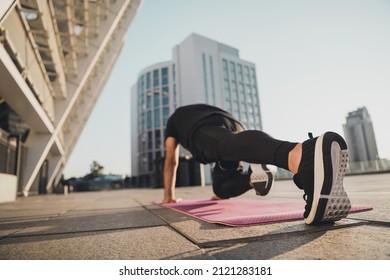 Photo of confident motivated old pensioner man stand plank yoga mat arms one leg wear t-shirt urban town outside - Powered by Shutterstock