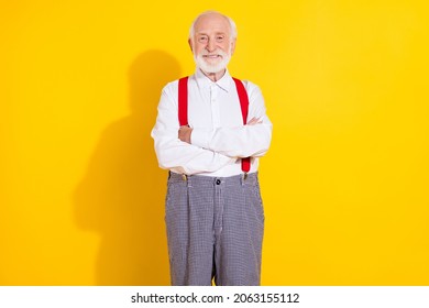 Photo Of Confident Old Boss Grey Hair Man Crossed Palms Wear White Shirt Suspenders Isolated On Yellow Color Background