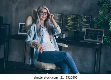 Photo of confident pensioner retired lady ceo company owner ready security improve development sit chair in workspace