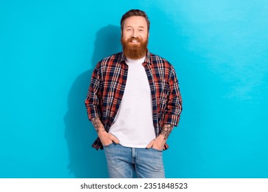 Photo of confident positive man dressed plaid shirt smiling hands arms pockets isolated blue color background - Powered by Shutterstock