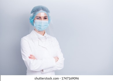 Photo of confident professional virologist doctor lady arms crossed good mood sterile clean uniform wear medical lab coat mask facial plastic protection surgical cap isolated grey background - Powered by Shutterstock