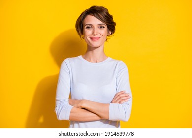 Photo Of Confident Young Woman Folded Hands Look Camera Wear White Shirt Isolated Yellow Color Background