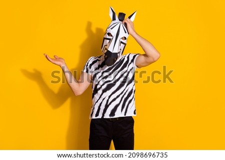 Photo of confused stupid guy dressed wild animal arm hand head forget important thing isolated yellow color background