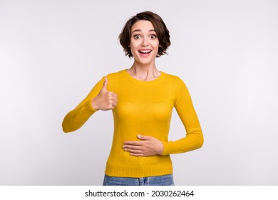 Photo Of Cool Brunette Young Lady Thumb Up Wear Yellow Shirt Isolated On Grey Color Background