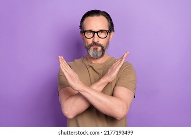 Photo of cool confident man cross hands asking you to stop enough bullying isolated on violet color background - Shutterstock ID 2177193499