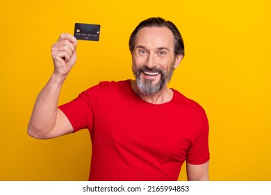 Photo Of Cool Mature Brunet Man Show Card Wear Red T-shirt Isolated On Yellow Color Background