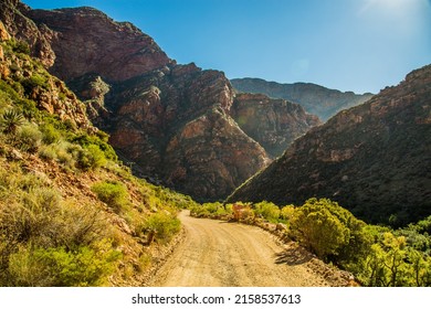 a photo of countyside road going to mountain valley - Shutterstock ID 2158537613