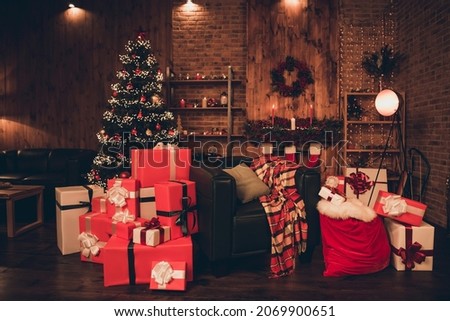 Photo of cozy north-pole santa claus house christmas tree season present chair indoors inside home apartment