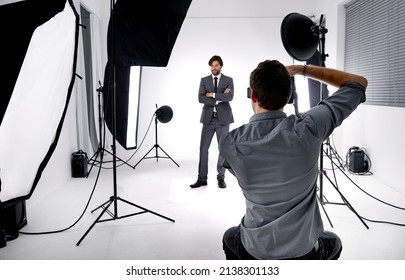 Photo craft. Shot of a photographer working in his studio. - Shutterstock ID 2138301133