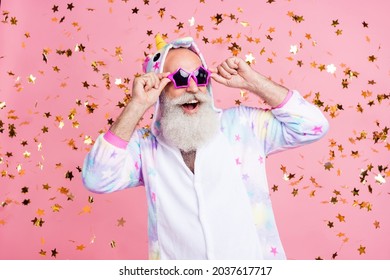 Photo Of Crazy Clubber Retired Bearded Man Dance Confetti Fall Wear Sunglass Kigurumi Pajama Isolated Pink Color Background