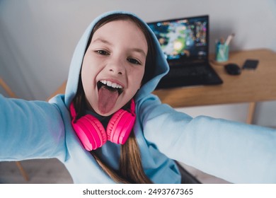 Photo of crazy cool funly positive cute girl blogger gamer showing room recording video live stream indoors house - Powered by Shutterstock