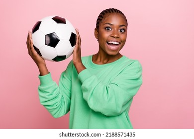 Photo of crazy funky girl hold football toothy smile look camera isolated on pink color background - Powered by Shutterstock