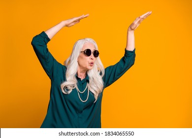 Photo Of Crazy Funky Grandma Lady Music Lover Senior Retro Party Cool Look Dancing Strange Youngster Moves Wear Green Shirt Sun Specs Necklace Isolated Bright Yellow Color Background