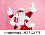 Photo of crazy funky santa claus enjoy listen x-mas christmas fairy jolly radio headphones raise fingers wear headwear sunglass suspenders isolated over pastel color background