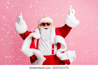 Photo of crazy funky santa claus enjoy listen x-mas christmas fairy jolly radio headphones raise fingers wear headwear sunglass suspenders isolated over pastel color background - Powered by Shutterstock