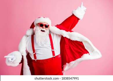 Photo of crazy funny fat santa claus with big belly enjoy x-mas christmas jolly event discotheque dance raise fingers wear headwear suspenders isolated over pastel color background - Powered by Shutterstock