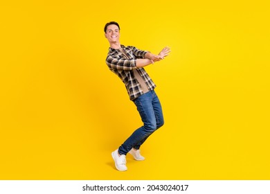 Photo of crazy hipster funny guy dance modern move wear plaid shirt jeans shoes isolated yellow color background - Shutterstock ID 2043024017