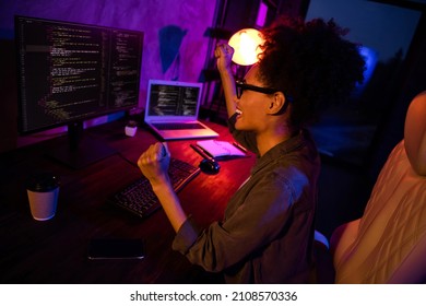 Photo of crazy lady freelancer use device develop java script fists up sit desk evening late in workspace workplace - Powered by Shutterstock