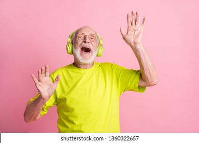 Photo Of Crazy Old Man Listen Music Dance Arms Wear Headphones Spectacles Lime Color Clothes Isolated On Pink Background