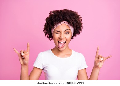 Photo of crazy rocker lady showing horns tongue out mouth close eye wear white t-shirt isolated pink background