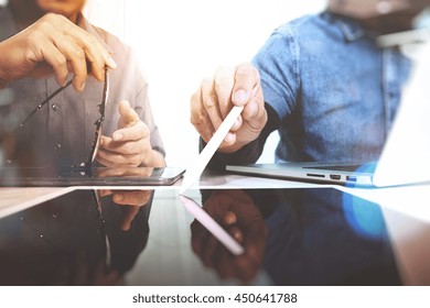 Photo creative designers team work concept. Man working  new startup project in modern studio.Digital tablet laptop computer design smart phone using. - Powered by Shutterstock