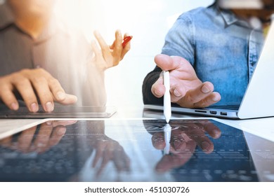 Photo creative designers team work concept. Man working  new startup project in modern studio.Digital tablet laptop computer  smart phone using.Idea design progress ,Sun flare effect
 - Powered by Shutterstock