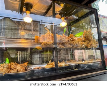 Photo Of Crispy Fried Chicken Which Has Now Become A Very Cheap Street Food. Sold On The Side Of The Road And Placed In A Place Like A Transparent Cupboard